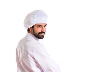 Chef with his arms crossed over white background