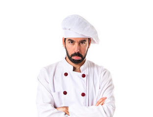 Sad chef over white background
