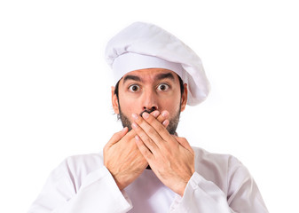 Chef doing surprise gesture over white background