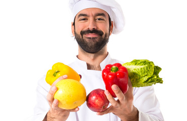 Chef holding vegetables