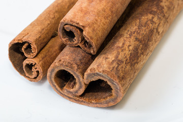 Cinnamon sticks on white background