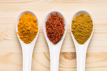 Various spices on wooden background