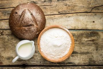 Bakery ingredients with loaf of bread