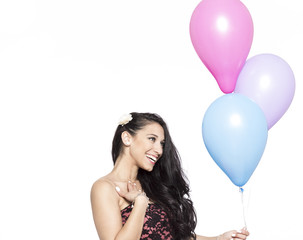 Attractive Young Smiling Brunette holding Colorful Balloons - 83643182