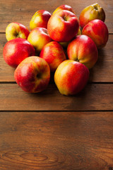 Fresh apples on the picnic table background