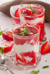 Glasses of Layered Dessert with mint leaves