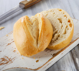 Fresh bread on  wooden table.