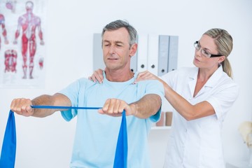 Fototapeta premium Doctor examining her patient back 