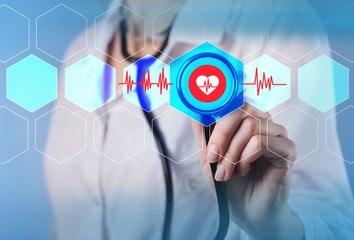 Conceptual photo. Doctor holding a stethoscope in his hand.