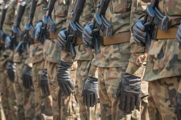 Army parade - armed soldiers in camouflage military uniform