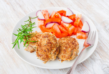 Fried pork chop with tomato salsa