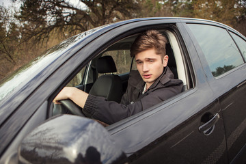 The young man behind the wheel,  traveling