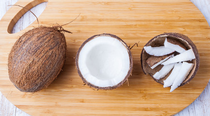 Chopped coconuts on wooden table