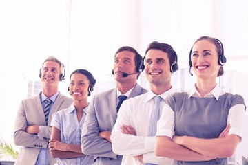 Business people with headsets looking at top 