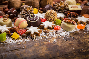 Wooden background with chocolate sweets