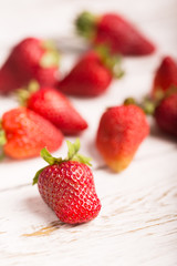 Strawberries on the wooden background