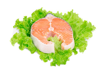 Fresh salmon steak on lettuce.