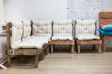 Wooden furniture soft corner, several chairs in modern interior