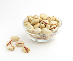 Inshell pistachio nuts in cup.