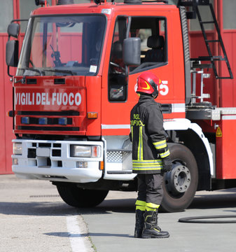 italian firefighters during an emergency with protective suits