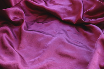 background texture of shiny red silk