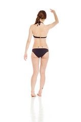 Fototapeta premium Model isolated back pointing