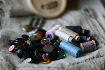 Fototapeta na wymiar Crafts thread dressmaking scissors buttons