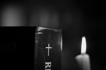 burning candle and bible religion