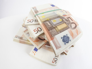Pile of fifty euro banknotes