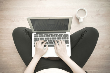 Woman using laptop at home