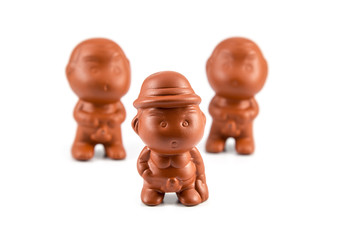 Clay dolls boy peeing isolated on white background.