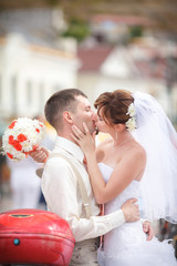 Kissing bride groom wedding day outdoors