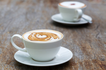 art latte coffee on white cup