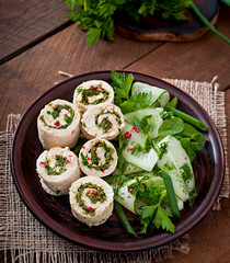 Steamed chicken rolls with greens and fresh vegetable salad