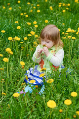 Little girl walks in the park