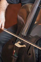 Man playing the cello, hand close up