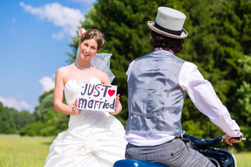 Wedding with scooter and just married sign