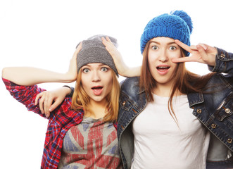 two young girl friends standing together 