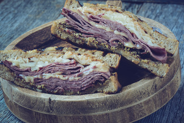 New Yorker Sandwich with Instagram Style Filter on rustic wood b