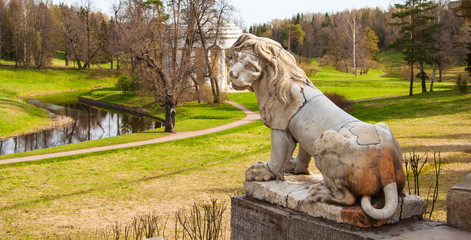 Sculpture of a lion in a landscape park of Pavlovsk