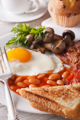 eggs with bacon and vegetables close-up on a plate. Vertical
