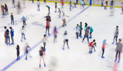 Defocused of indoor ice skating park with skating people. - 83664344