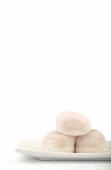 Three White Mochi on White Background in Vertical