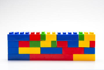 Wall made from plastic building blocks. - 83664716