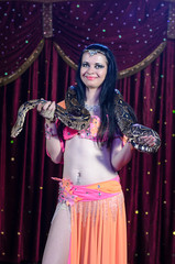 Portrait of Snake Dancer with Large Snake on Stage