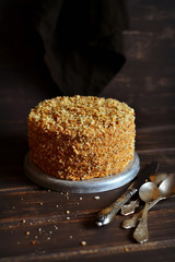 honey cake on a dark wooden surface 