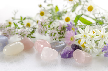 Fototapeta na wymiar gemstones with herbal flowers
