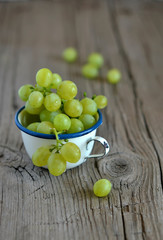 fresh green grapes in a vintage mug 