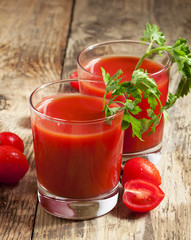 Fresh tomato juice with herbs and tomatoes, selective focus