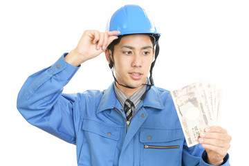 札束を持つ労働者